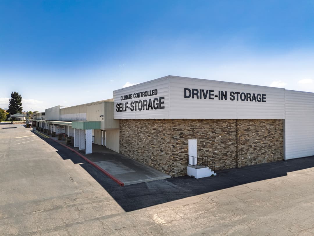 Climate-controlled drive-in self-storage facility with accessible loading area and clear signage.