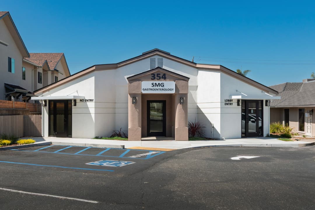 Exterior of SMG Gastroenterology building with clear entry points and parking area.
